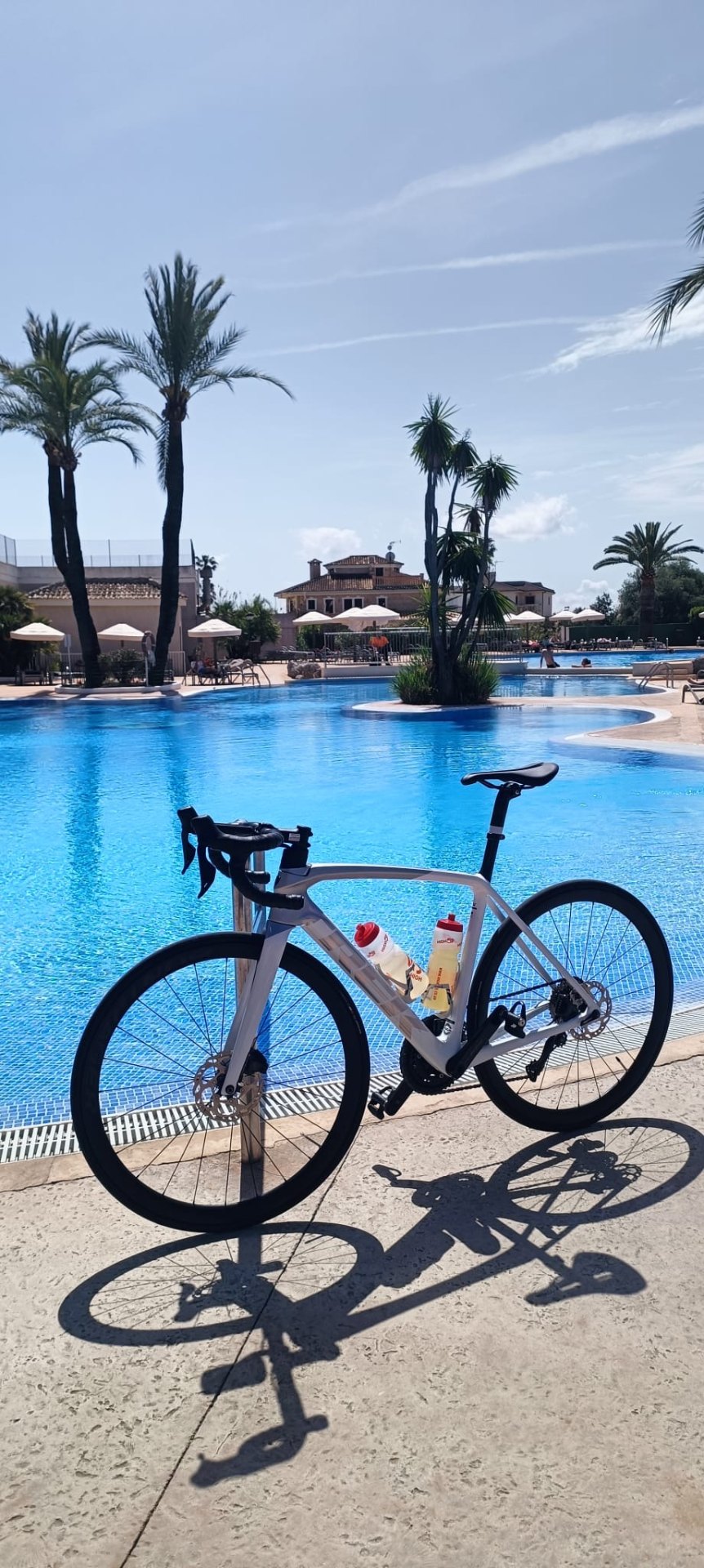 Road bike beside a resort pool
